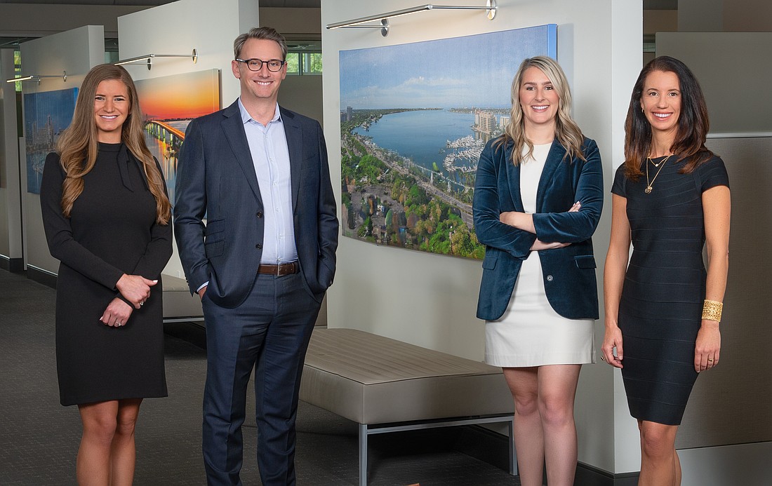 Jillian Augustine, Simon Bacon, Kayla Fleeman and Michelle Esposito Young work in the Developer Services division for Michael Saunders & Co.