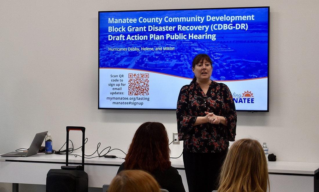 Michelle Davis, grants division manager for Manatee County, presents the county's Action Plan to residents June 3.